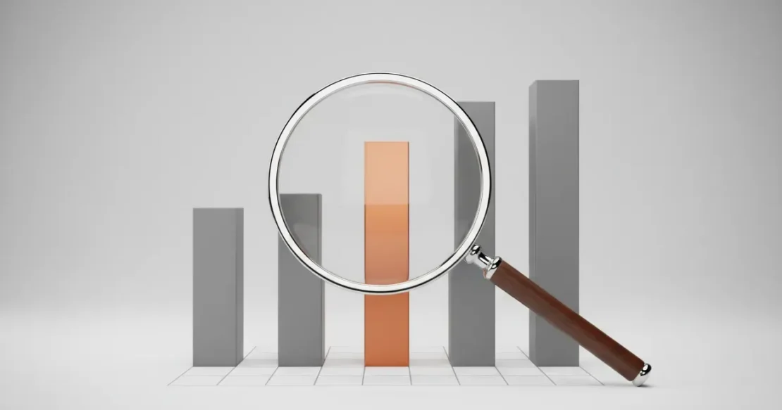 Magnifying glass highlighting a single standout bar on a minimalist chart, symbolizing insights from competitor research.